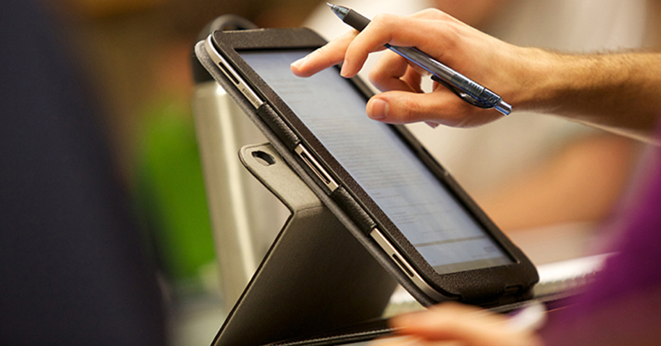 Student in class using tablet