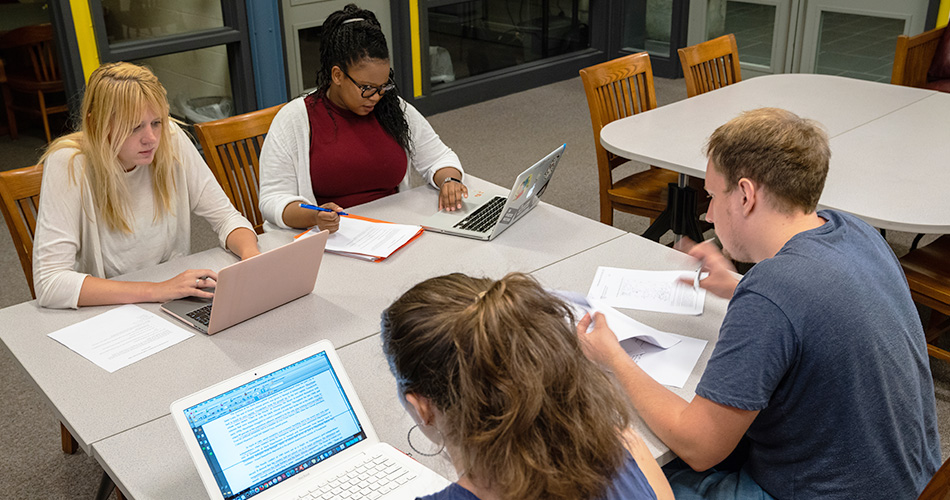 Students sitting at a table studying