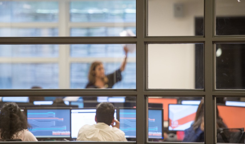 Students looking at computer screens in classroom