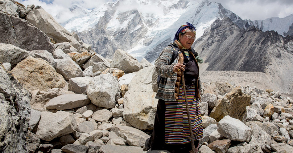 Local woman walking on Mt Everest