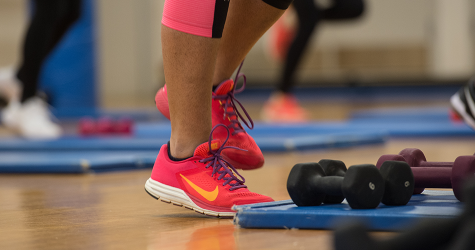 A person's feet at the gym