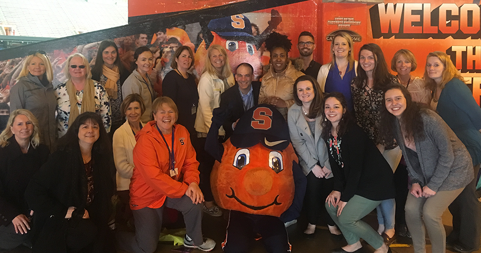 Group of people with Otto the Orange