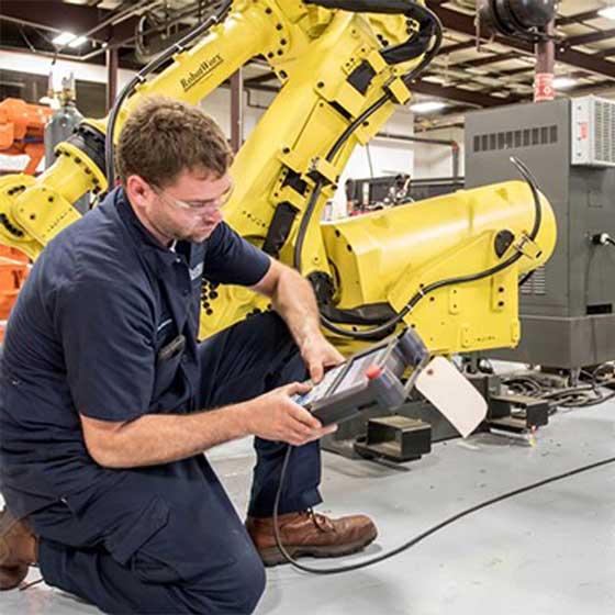 Worker using robotic equipment