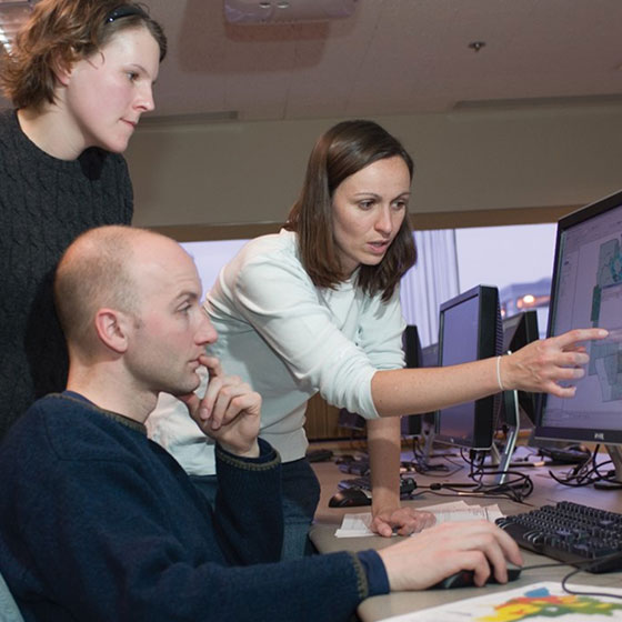 Professor Robinson with students in GIS lab