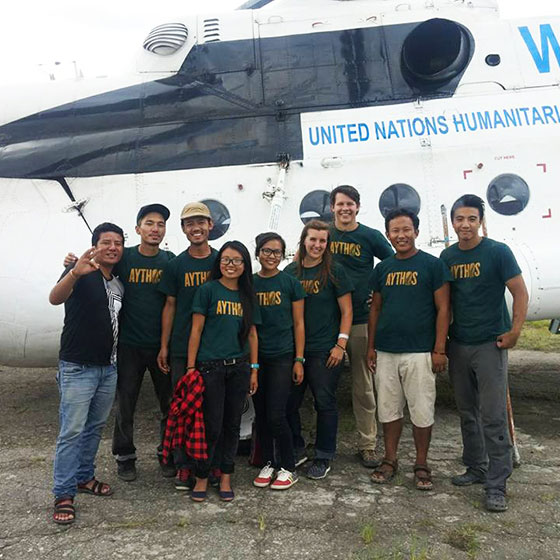 Students waiting by UN helicopter