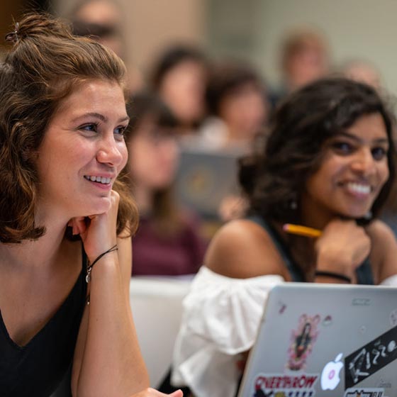 Students smiling in a classroom