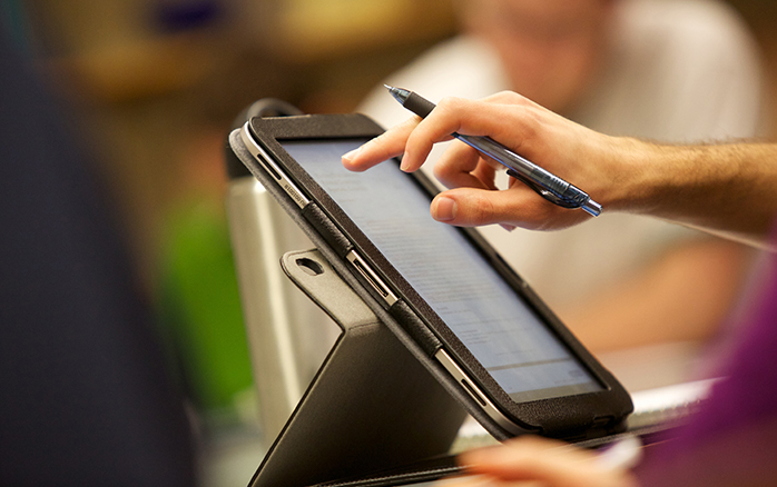 Student in class using tablet