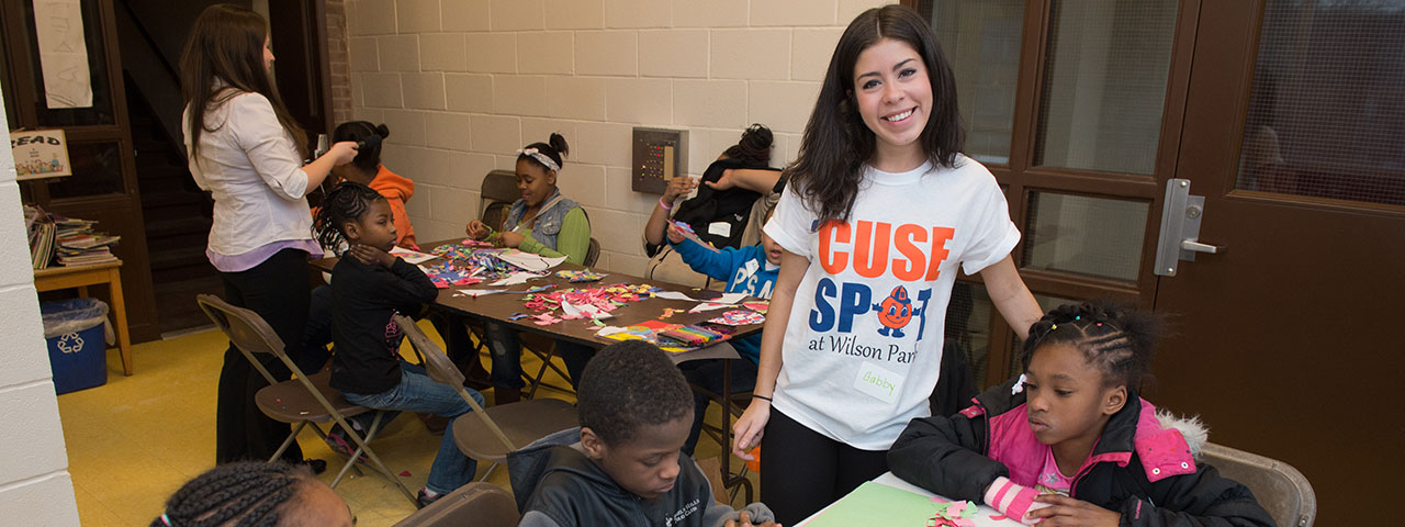 Syracuse University student working in the Syracuse community