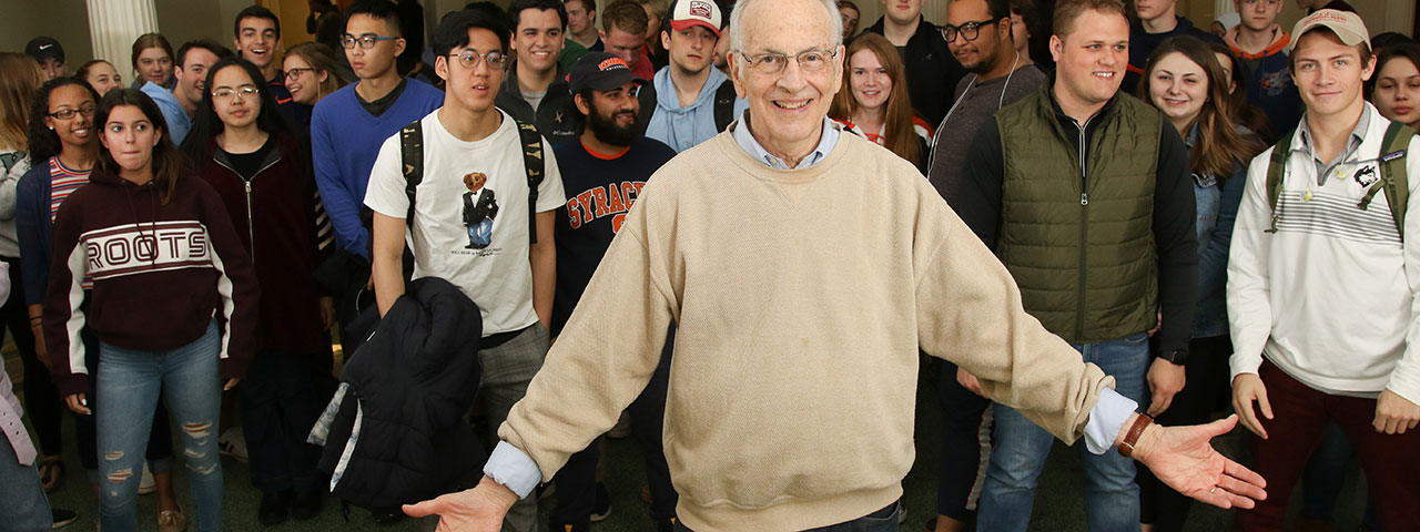 Professor Bill Coplin with students outside of Maxwell Auditorium