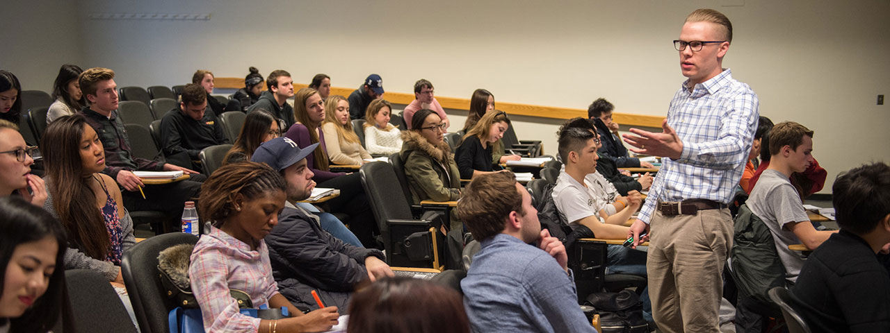 Prof. Daniel McDowell teaching in front of a class