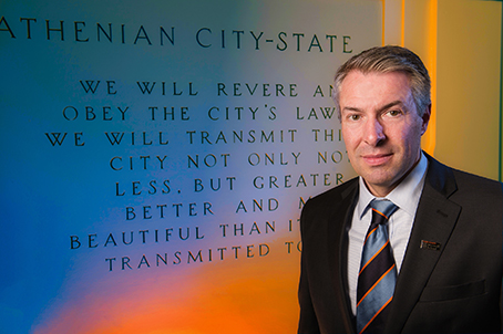 Dean David Van Slyke in front of Athenian Oath