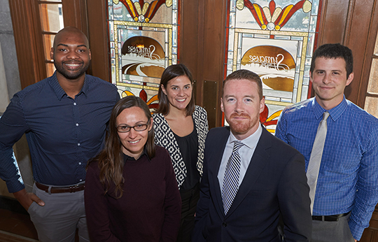 Jonnell Robinson posing with the City of Syracuse's office of innovation staffmembers