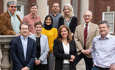 Several Maxwell faculty members standing outside