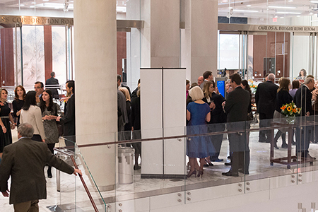 Partygoers in formal dress mingling