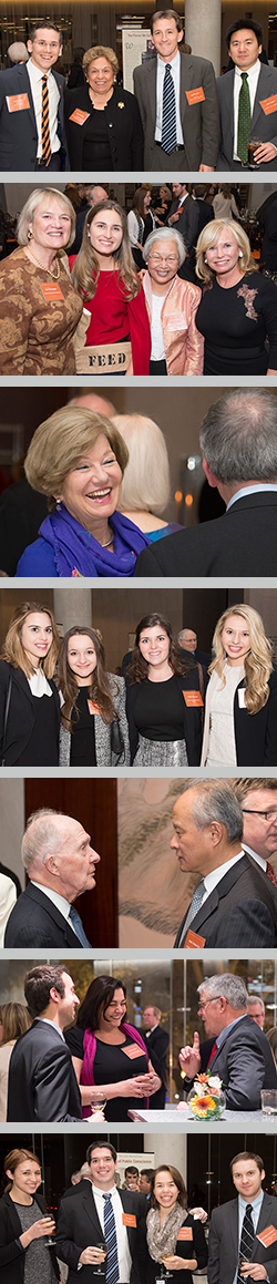 Partygoers posing for photos, laughing, smiling and talking with each other