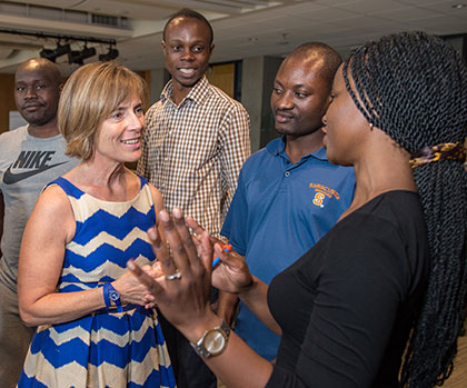 Mandela Fellows talking to Anne Wadsworth, executive director of the Girls Education Collaborative