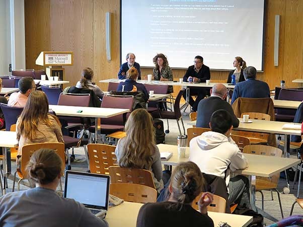 A panel presenting in Egger Hall